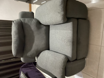 Sillón reclinable de tela gris 